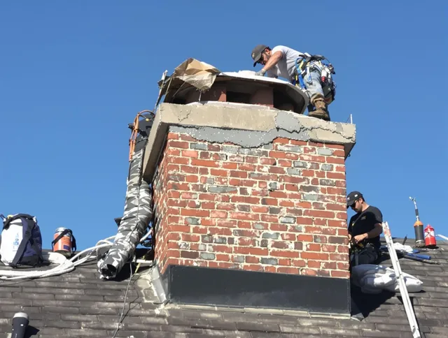 Swampscott Chimney Sweep installing a custom chimney crown in Swampscott, MA