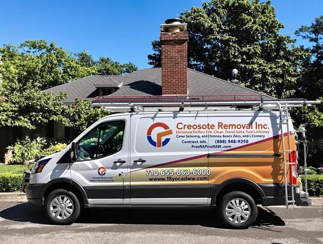 Swampscott Chimney Sweep technician removing creosote safely in Swampscott, MA