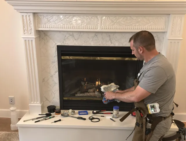 Swampscott Chimney Sweep performing fireplace maintenance in Swampscott, MA